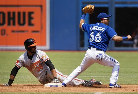 Baltimore Orioles Chris Dickerson (L) is safe at second after Toronto Blue Jays Munenori Kawasaki applied the tag during the first inning of Baltimore Orioles Chris Dickerson (L) is safe at second after Toronto Blue Jays Munenori Kawasaki applied the tag during the first inning of