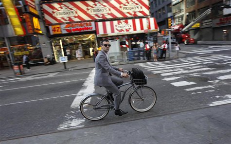 A man rides a bicycle down 7th Avenue through Times Square in the early morning in this June 21, 2010 file photo. REUTERS/Mike Segar/Files A man rides a bicycle down 7th Avenue through Times Square in the early morning in this June 21, 2010 file photo. REUTERS/Mike Segar/Files