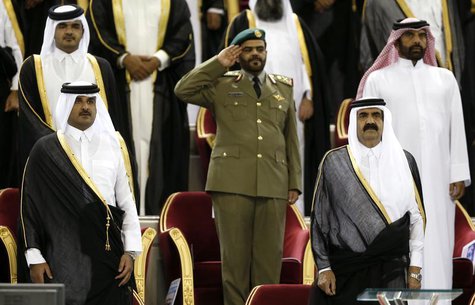 Qatar's Emir Sheikh Hamad bin Khalifa al-Thani (R) stands next to his son Crown Prince Sheikh Tamim bin Hamad al-Thani before the Emir Cup f Qatar's Emir Sheikh Hamad bin Khalifa al-Thani (R) stands next to his son Crown Prince Sheikh Tamim bin Hamad al-Thani before the Emir Cup f