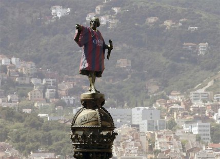 Barcelona's statue of Cristobal Colon, also known as Christopher Colombus, is seen decked out with the 2013-2014 Barcelona team soccer jerse Barcelona's statue of Cristobal Colon, also known as Christopher Colombus, is seen decked out with the 2013-2014 Barcelona team soccer jerse