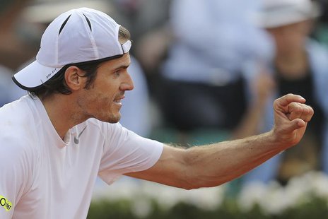 Tommy Haas of Germany discusses a line call with an umpire during his men's singles quarter-final match against Novak Djokovic of Serbia at Tommy Haas of Germany discusses a line call with an umpire during his men's singles quarter-final match against Novak Djokovic of Serbia at