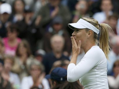 Maria Sharapova of Russia reacts after defeating Kristina Mladenovic of France in their women's singles tennis match at the Wimbledon Tennis Maria Sharapova of Russia reacts after defeating Kristina Mladenovic of France in their women's singles tennis match at the Wimbledon Tennis