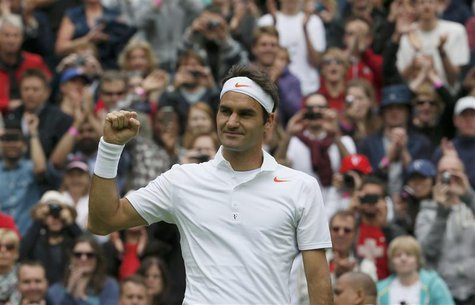 Roger Federer of Switzerland celebrates after defeating Victor Hanescu of Romania in their men's singles tennis match at the Wimbledon Tenni Roger Federer of Switzerland celebrates after defeating Victor Hanescu of Romania in their men's singles tennis match at the Wimbledon Tenni