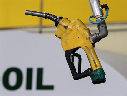 A gas pump is seen hanging from the ceiling at a petrol station in Seoul June 27, 2011. REUTERS/Jo Yong-Hak A gas pump is seen hanging from the ceiling at a petrol station in Seoul June 27, 2011. REUTERS/Jo Yong-Hak