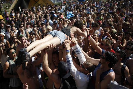 A woman crowd surfs across dancers at the Do Lab at the 2012 Coachella Valley Music and Arts Festival in Indio, California April 14, 2012. R A woman crowd surfs across dancers at the Do Lab at the 2012 Coachella Valley Music and Arts Festival in Indio, California April 14, 2012. R