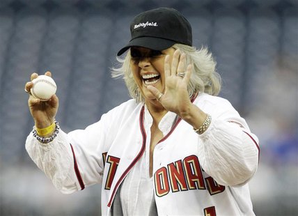 Food Network personality Paula Deen laughs before throwing out the first pitch prior to the Washington Nationals versus New York Mets MLB ba Food Network personality Paula Deen laughs before throwing out the first pitch prior to the Washington Nationals versus New York Mets MLB ba