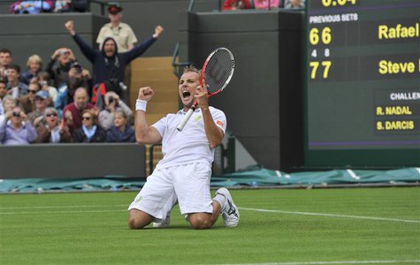 Steve Darcis of Belgium celebrates after defeating Rafael Nadal of Spain in their men's singles tennis match at the Wimbledon Tennis Champio Steve Darcis of Belgium celebrates after defeating Rafael Nadal of Spain in their men's singles tennis match at the Wimbledon Tennis Champio