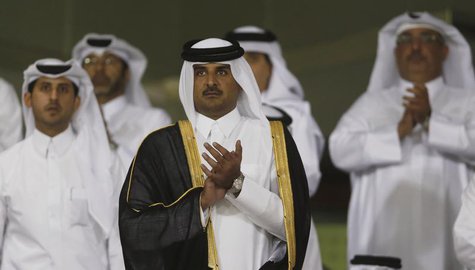 Qatar's Crown Prince Sheikh Tamim bin Hamad al-Thani (C) arrives at Al-Sadd Stadium for the final Crown Prince Cup soccer match between Qata Qatar's Crown Prince Sheikh Tamim bin Hamad al-Thani (C) arrives at Al-Sadd Stadium for the final Crown Prince Cup soccer match between Qata