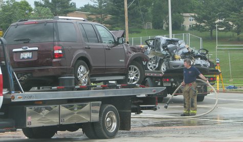Ford Explorer and Ford Taurus loaded on tow trucks after crash at 17th Ave. and Stewart Ave. in Wausau 6/24/13
Ford Explorer and Ford Taurus loaded on tow trucks after crash at 17th Ave. and Stewart Ave. in Wausau 6/24/13