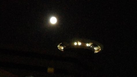 Supermoon coming in for landing on Radison Plaza Supermoon coming in for landing on Radison Plaza