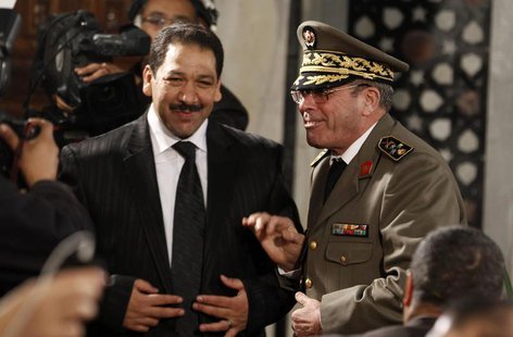 Tunisian Armed Forces General Rachid Ammar (R) speaks with Interior Minister Lotfi Ben Jeddou at the government palace in Tunis March 14, 20 Tunisian Armed Forces General Rachid Ammar (R) speaks with Interior Minister Lotfi Ben Jeddou at the government palace in Tunis March 14, 20