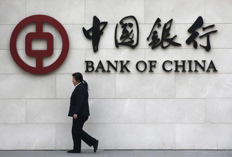 A woman walks past a sign of Bank of China at its branch in Beijing March 26, 2013. REUTERS/Kim Kyung-Hoon A woman walks past a sign of Bank of China at its branch in Beijing March 26, 2013. REUTERS/Kim Kyung-Hoon