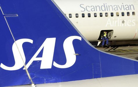 A loader sits in the cargo bay of an SAS Boeing 737 aircraft parked at Arlanda airport's Terminal Five, north of Stockholm November 13, 2012 A loader sits in the cargo bay of an SAS Boeing 737 aircraft parked at Arlanda airport's Terminal Five, north of Stockholm November 13, 2012