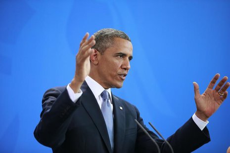 U.S. President Barack Obama gestures during a news conference after his meeting with German Chancellor Angela Merkel at the Chancellery in B U.S. President Barack Obama gestures during a news conference after his meeting with German Chancellor Angela Merkel at the Chancellery in B