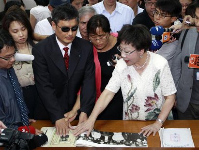 Chinese dissident Chen Guangcheng (3rd L) and his wife Yuan Weijing (C) visit Jing-mei Human Rights Memorial and Cultural Park with Taiwan's Chinese dissident Chen Guangcheng (3rd L) and his wife Yuan Weijing (C) visit Jing-mei Human Rights Memorial and Cultural Park with Taiwan's