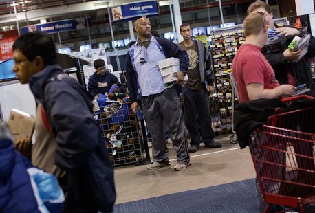 A man waits in line to purchase items at the Best Buy electronics store in Westbury, New York November 23, 2012. REUTERS/Shannon Stapleton A man waits in line to purchase items at the Best Buy electronics store in Westbury, New York November 23, 2012. REUTERS/Shannon Stapleton