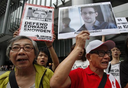 Protesters in support of Edward Snowden, a contractor at the National Security Agency (NSA), chant slogans before marching to U.S. Consulate Protesters in support of Edward Snowden, a contractor at the National Security Agency (NSA), chant slogans before marching to U.S. Consulate