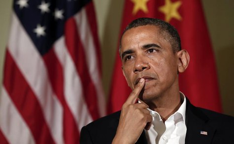 U.S. President Barack Obama listens to a response from Chinese President Xi Jinping at The Annenberg Retreat at Sunnylands in Rancho Mirage, U.S. President Barack Obama listens to a response from Chinese President Xi Jinping at The Annenberg Retreat at Sunnylands in Rancho Mirage,