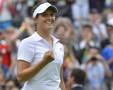 Laura Robson of Britain celebrates after defeating Maria Kirilenko of Russia in their women's singles tennis match at the Wimbledon Tennis C Laura Robson of Britain celebrates after defeating Maria Kirilenko of Russia in their women's singles tennis match at the Wimbledon Tennis C