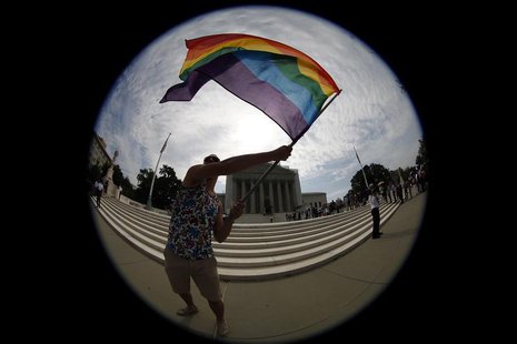 Gay marriage supporter Vin Testa waves a rainbow flag in anticipation of U.S. Supreme Court rulings in the cases against California's gay ma Gay marriage supporter Vin Testa waves a rainbow flag in anticipation of U.S. Supreme Court rulings in the cases against California's gay ma