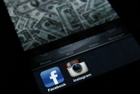 A photo illustration shows the applications Facebook and Instagram on the screen of an iPhone in Zagreb April 9, 2012. REUTERS/Antonio Broni A photo illustration shows the applications Facebook and Instagram on the screen of an iPhone in Zagreb April 9, 2012. REUTERS/Antonio Broni