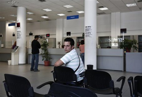 Greek Vangelis Xideas, 25, waits inside a Greek Manpower Employment Organisation office at a suburb of Athens June 14, 2013. REUTERS/Yorgos Greek Vangelis Xideas, 25, waits inside a Greek Manpower Employment Organisation office at a suburb of Athens June 14, 2013. REUTERS/Yorgos