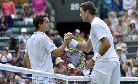 Juan Martin del Potro of Argentina (R) shakes hands with Albert Ramos of Spain after defeating him in their men's singles tennis match at th Juan Martin del Potro of Argentina (R) shakes hands with Albert Ramos of Spain after defeating him in their men's singles tennis match at th