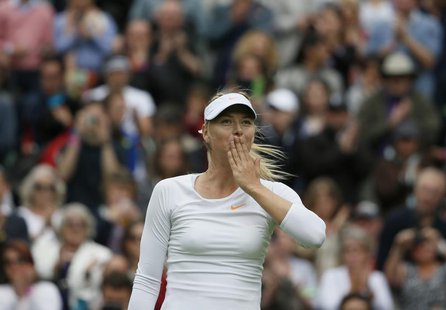 Maria Sharapova of Russia reacts after defeating Kristina Mladenovic of France in their women's singles tennis match at the Wimbledon Tennis Maria Sharapova of Russia reacts after defeating Kristina Mladenovic of France in their women's singles tennis match at the Wimbledon Tennis