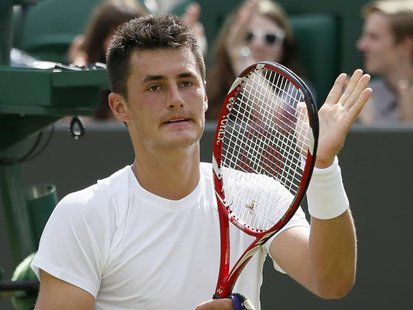 Bernard Tomic of Australia celebrates after defeating Sam Querrey of the U.S. in their men's singles tennis match at the Wimbledon Tennis Ch Bernard Tomic of Australia celebrates after defeating Sam Querrey of the U.S. in their men's singles tennis match at the Wimbledon Tennis Ch