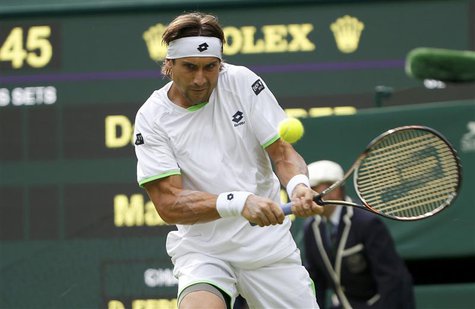 David Ferrer of Spain hits a return to Martin Alund of Argentina in their men's singles tennis match at the Wimbledon Tennis Championships, David Ferrer of Spain hits a return to Martin Alund of Argentina in their men's singles tennis match at the Wimbledon Tennis Championships,