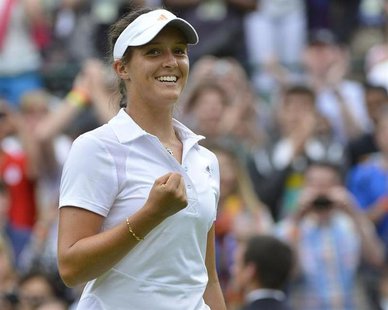 Laura Robson of Britain celebrates after defeating Maria Kirilenko of Russia in their women's singles tennis match at the Wimbledon Tennis C Laura Robson of Britain celebrates after defeating Maria Kirilenko of Russia in their women's singles tennis match at the Wimbledon Tennis C