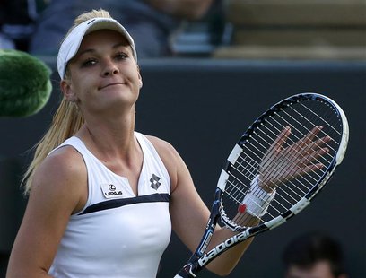 Agnieszka Radwanska of Poland reacts after defeating Yvonne Meusburger of Austria in their women's singles tennis match at the Wimbledon Ten Agnieszka Radwanska of Poland reacts after defeating Yvonne Meusburger of Austria in their women's singles tennis match at the Wimbledon Ten