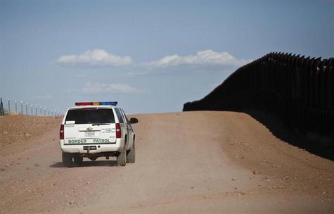 U.S. Border Patrol surveys the border fence near rancher John Ladd's property adjacent to the Arizona-Mexico border near Naco, Arizona, Marc U.S. Border Patrol surveys the border fence near rancher John Ladd's property adjacent to the Arizona-Mexico border near Naco, Arizona, Marc