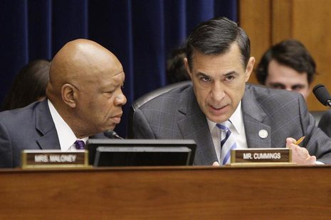 Committee chairman U.S. Representative Darrell Issa (R-CA) (R) and ranking member Rep. Elijah Cummings (D-MD) (L) confer during a House Over Committee chairman U.S. Representative Darrell Issa (R-CA) (R) and ranking member Rep. Elijah Cummings (D-MD) (L) confer during a House Over