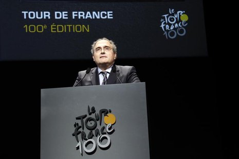 Corsica executive council president Paul Giacobbi poses next to the itinerary of the 2013 Tour de France cycling race during a presentation Corsica executive council president Paul Giacobbi poses next to the itinerary of the 2013 Tour de France cycling race during a presentation