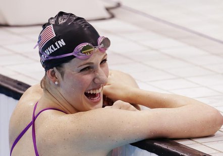 Missy Franklin laughs with her coach during warm ups at the London 2012 Olympic Games at the Aquatics Centre August 4, 2012. REUTERS/Tim Wim Missy Franklin laughs with her coach during warm ups at the London 2012 Olympic Games at the Aquatics Centre August 4, 2012. REUTERS/Tim Wim