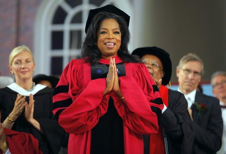 Media mogul Oprah Winfrey acknowledges the cheers from students and audience as she receives an honorary Doctor of Laws degree during Harvar Media mogul Oprah Winfrey acknowledges the cheers from students and audience as she receives an honorary Doctor of Laws degree during Harvar
