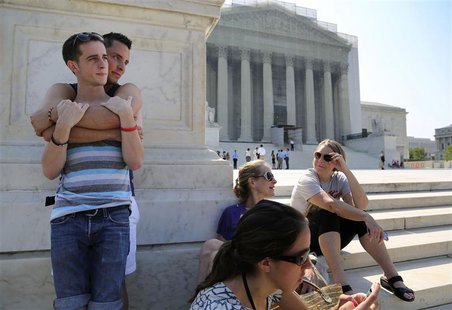 Chase Hardin (L) and Sam Knode (2nd L) join gay marriage supporters and court watchers hoping for U.S. Supreme Court rulings in the cases ag Chase Hardin (L) and Sam Knode (2nd L) join gay marriage supporters and court watchers hoping for U.S. Supreme Court rulings in the cases ag