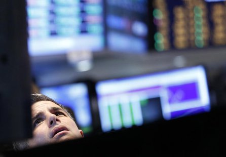 A trader looks up at a screen on the floor at the New York Stock Exchange, June 25, 2013. REUTERS/Brendan McDermid A trader looks up at a screen on the floor at the New York Stock Exchange, June 25, 2013. REUTERS/Brendan McDermid