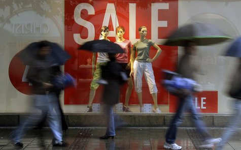 Pedestrians walk past a shop window with a sale sign, in Munich June 23, 2009. REUTERS/Michael Dalder Pedestrians walk past a shop window with a sale sign, in Munich June 23, 2009. REUTERS/Michael Dalder