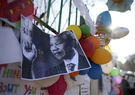 A photograph of former South African President Nelson Mandela with a handwritten message "You will always be our hero", is attached to the w A photograph of former South African President Nelson Mandela with a handwritten message "You will always be our hero", is attached to the w