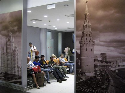 People spend time in a waiting room at the transit area of Moscow's Sheremetyevo airport June 26, 2013. REUTERS/Sergei Karpukhin People spend time in a waiting room at the transit area of Moscow's Sheremetyevo airport June 26, 2013. REUTERS/Sergei Karpukhin