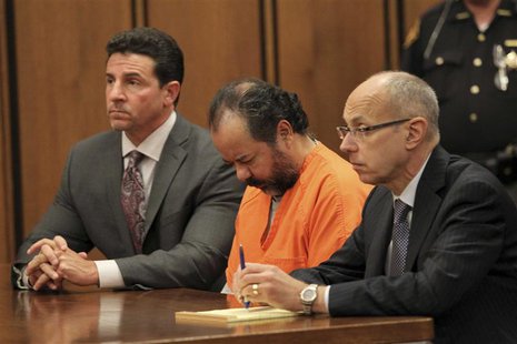 Ariel Castro sits with his head down between his attorneys Jaye Schlachet (R) and Craig Weintraub (L) during his pre-trial hearing on charge Ariel Castro sits with his head down between his attorneys Jaye Schlachet (R) and Craig Weintraub (L) during his pre-trial hearing on charge