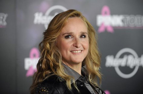 Singer Melissa Etheridge poses for photographers after receiving a star on the Hollywood Walk of Fame in Los Angeles September 27, 2011. REU Singer Melissa Etheridge poses for photographers after receiving a star on the Hollywood Walk of Fame in Los Angeles September 27, 2011. REU