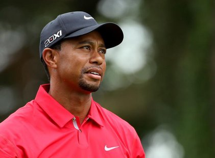Tiger Woods of the U.S. watches as his drive from the second tee goes out of bounds during the final round of the 2013 U.S. Open golf champi Tiger Woods of the U.S. watches as his drive from the second tee goes out of bounds during the final round of the 2013 U.S. Open golf champi
