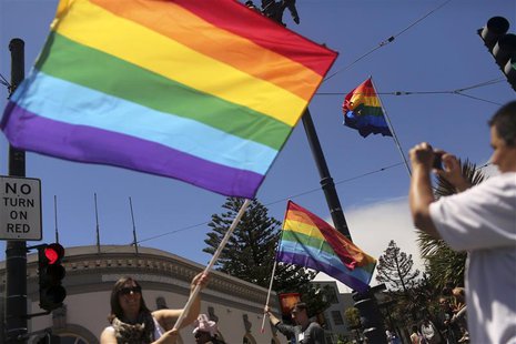 Same-sex marriage supporters take pictures in the Castro neighborhood in San Francisco, California after the U.S. Supreme Court ruled on Cal Same-sex marriage supporters take pictures in the Castro neighborhood in San Francisco, California after the U.S. Supreme Court ruled on Cal