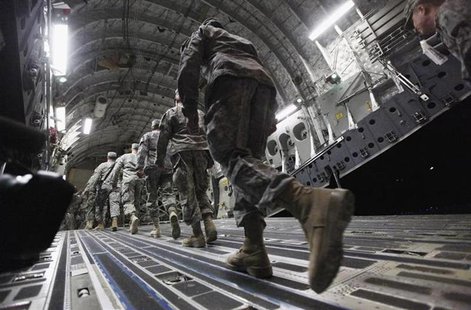 Soldiers from the 3rd Brigade, 1st Cavalry Division board a C-17 transport plane to depart from Iraq at Camp Adder, now known as Imam Ali Ba Soldiers from the 3rd Brigade, 1st Cavalry Division board a C-17 transport plane to depart from Iraq at Camp Adder, now known as Imam Ali Ba