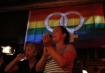 Patrons watch coverage of the U.S. Supreme Court ruling on the Defense of Marriage Act at the Stonewall Inn in New York June 26, 2013. REUTE Patrons watch coverage of the U.S. Supreme Court ruling on the Defense of Marriage Act at the Stonewall Inn in New York June 26, 2013. REUTE