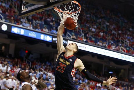 Maryland Terrapins center Alex Len (R) dunks the ball over North Carolina Tar Heels guard P.J. Hairston (L) during the first half of their A Maryland Terrapins center Alex Len (R) dunks the ball over North Carolina Tar Heels guard P.J. Hairston (L) during the first half of their A