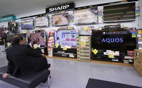 A man looks at Sharp Corp's Aquos television sets displayed at an electronics store in Tokyo January 15, 2013 file photo. REUTERS/Toru Hanai A man looks at Sharp Corp's Aquos television sets displayed at an electronics store in Tokyo January 15, 2013 file photo. REUTERS/Toru Hanai